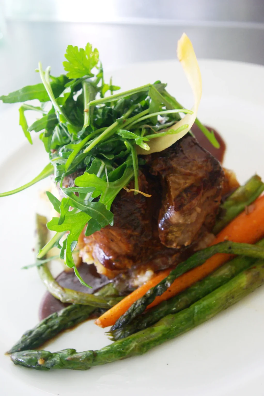 Fillet plated with vegetables